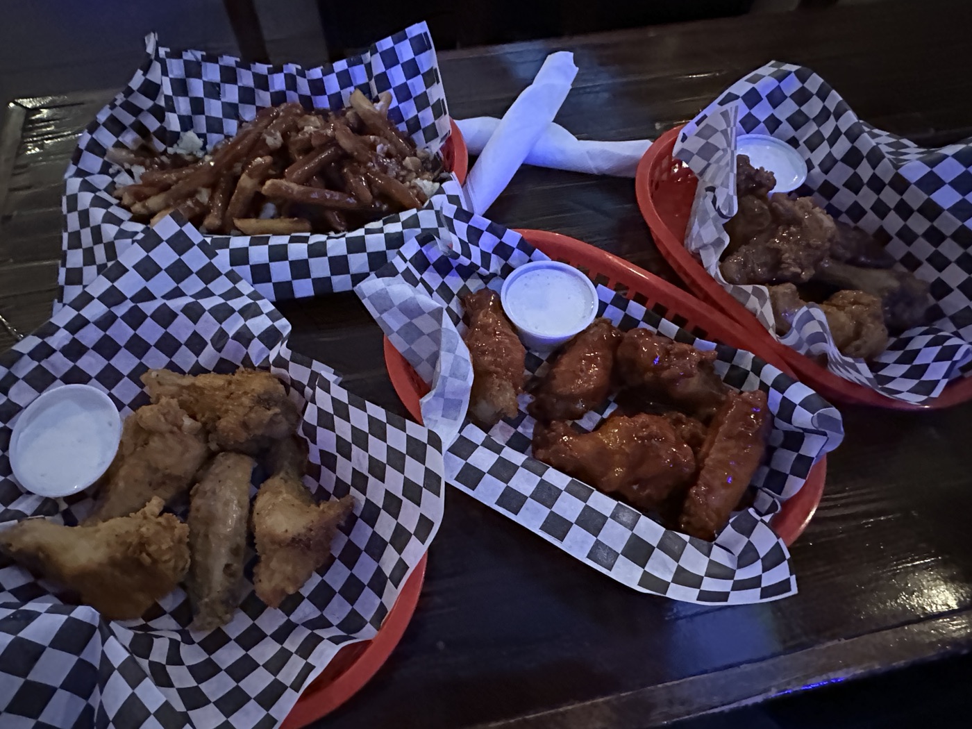 Whiskey Dicks signature dishes Smoked Wings, Brisket, Pulled Pork, The Hangover Burger